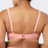 Back view of Parfait Lingerie Brigitte demi cup underwire balconette longline bikini top with embroidery detail in Peach Bud color.