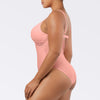 Side view of Parfait Lingerie Brigitte V-neck one-piece swimsuit in peach with lace detail, shelf bra, and full coverage.
