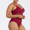 Parfait Lingerie Brigitte V-neck one-piece swimsuit in Rumba Red with lace detail, shelf bra, and full coverage, shown from side view
