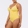 Parfait Lingerie Vivien Lemon Drop one-piece swimsuit with shelf bra, shirred detail, and bow back, shown from side angle.